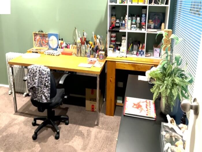 A well-organized art therapy room at Eltham Wellness Centre, featuring a creative workspace with art supplies, brushes, and paints neatly arranged on desks and shelves. The inviting setting fosters artistic expression and relaxation.