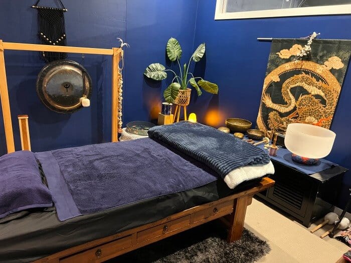 A serene, flexible space available for hire at Eltham Wellness Centre, featuring calming décor and ample room for wellness activities or events. The room is set up with comfortable seating, creating a welcoming and relaxing environment for group sessions, workshops, or private events.